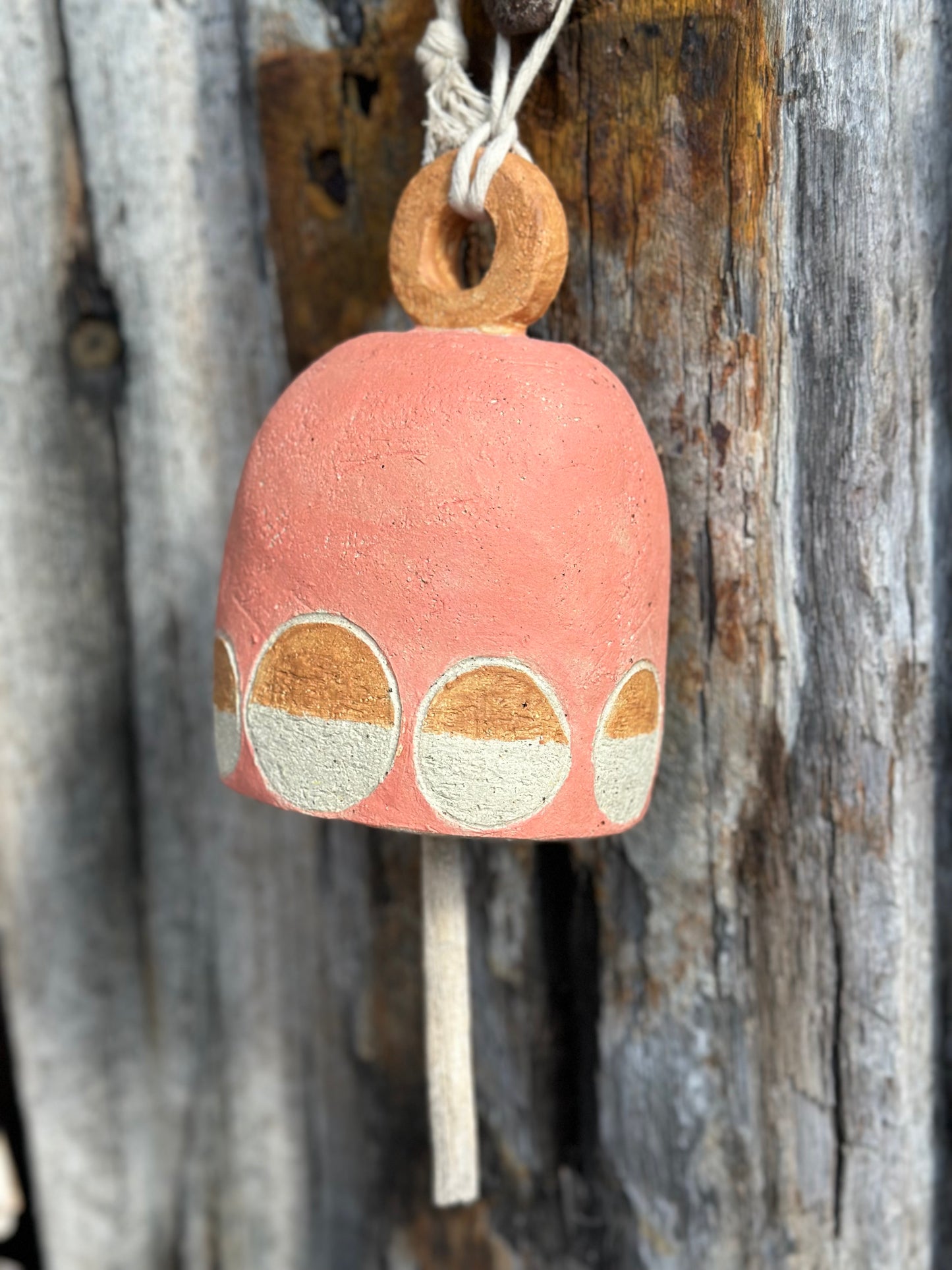 salmon and autumn tones  minimalist white motif on handmade ceramic bell with drift wood pendant
