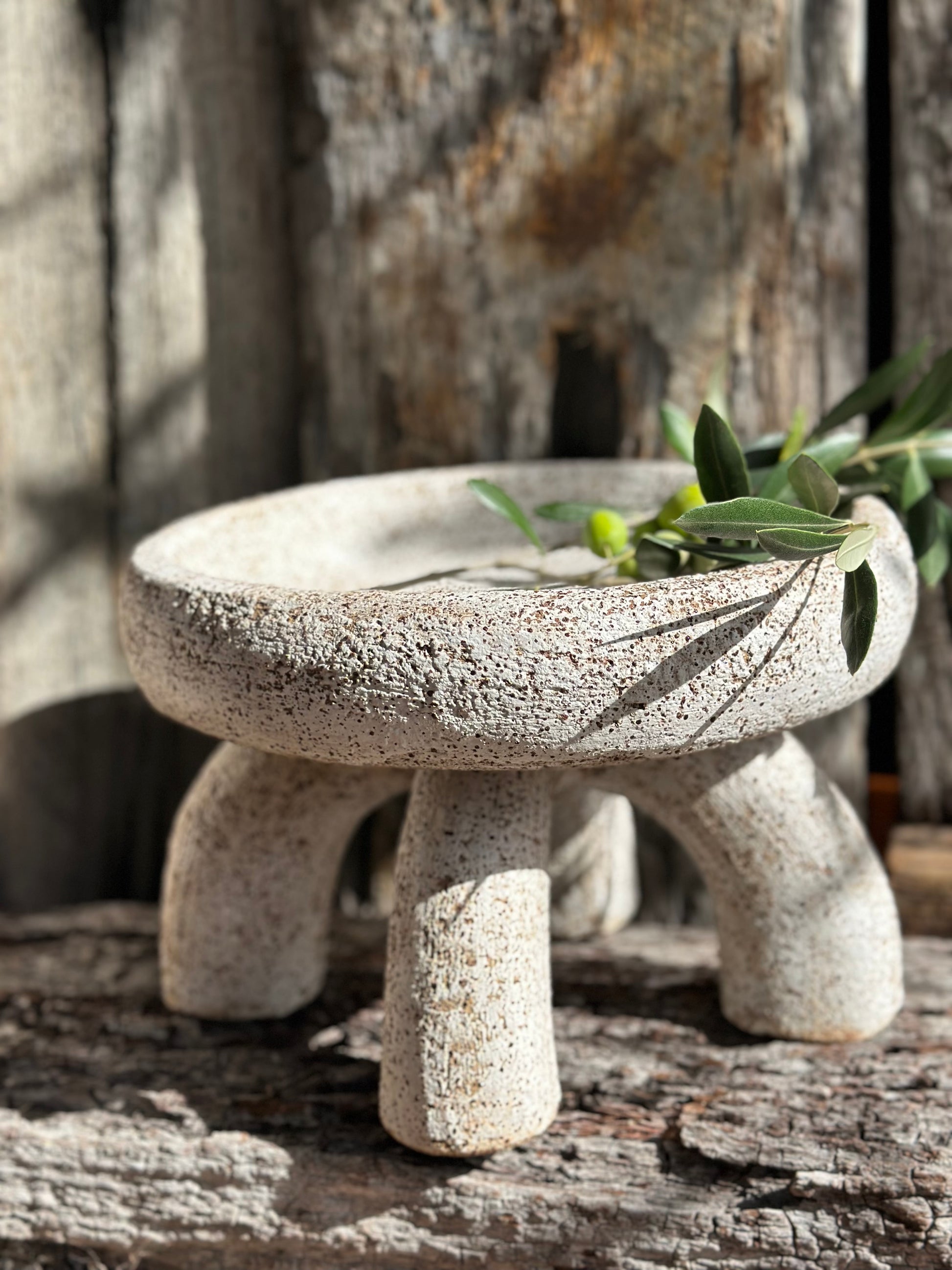 Sculptural ceramic piece composed of a shallow bowl balanced on four hand-built tubular legs, by Heidi Dickinson – Denmark, WA