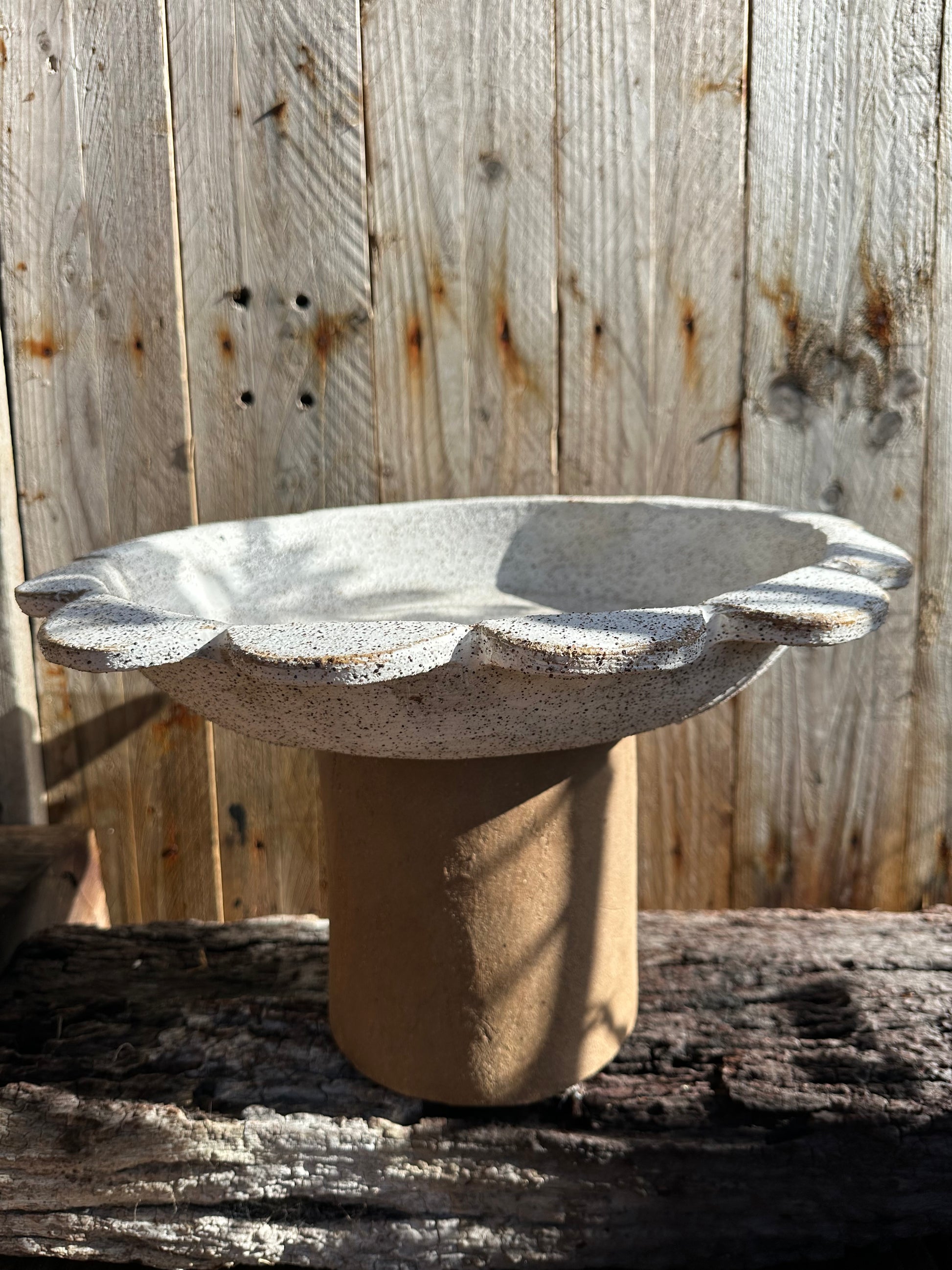 Two-piece ceramic vessel with architectural presence and organic curves, suitable for indoor or outdoor display