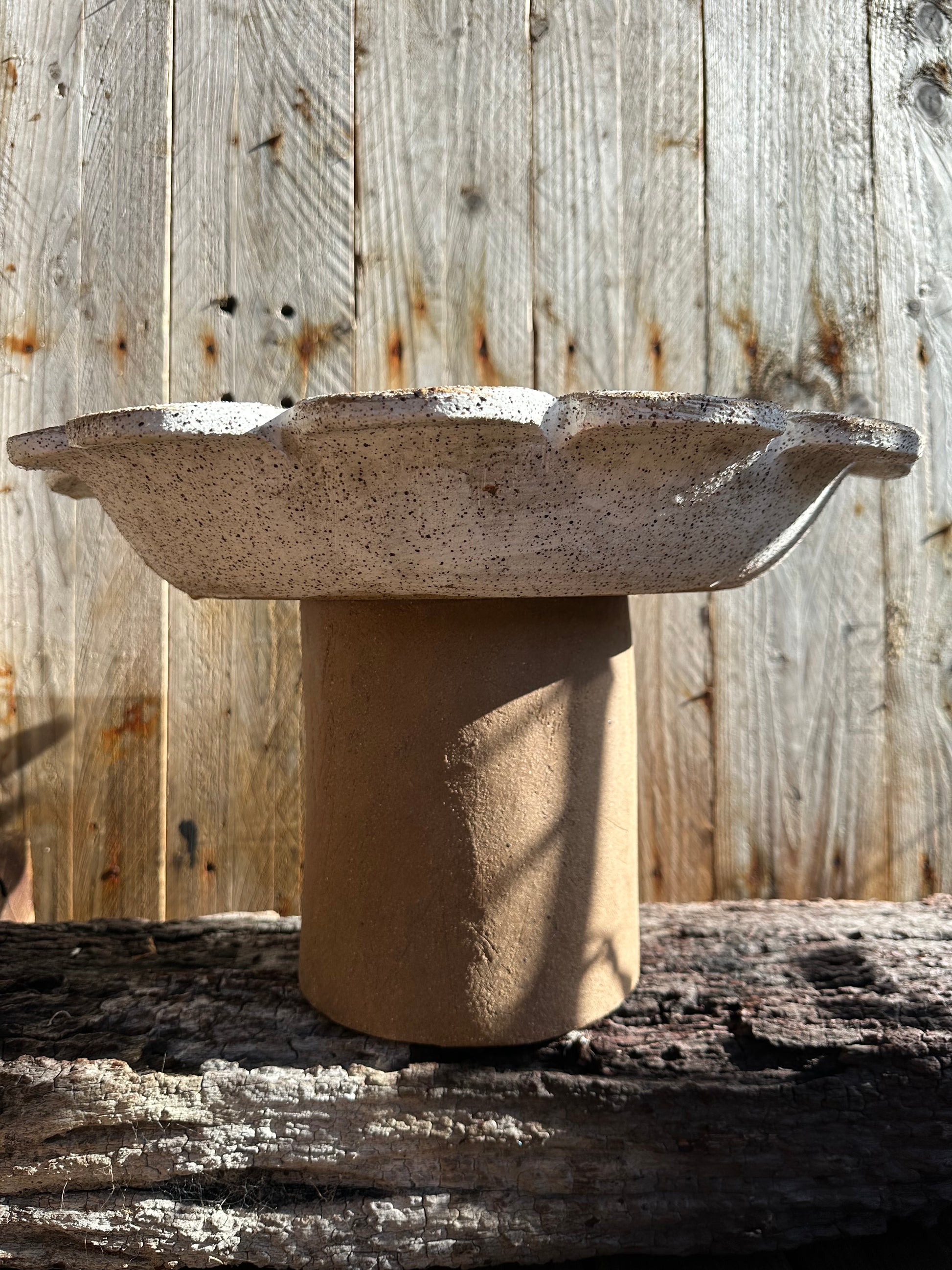 Two-piece ceramic vessel with architectural presence and organic curves, suitable for indoor or outdoor display