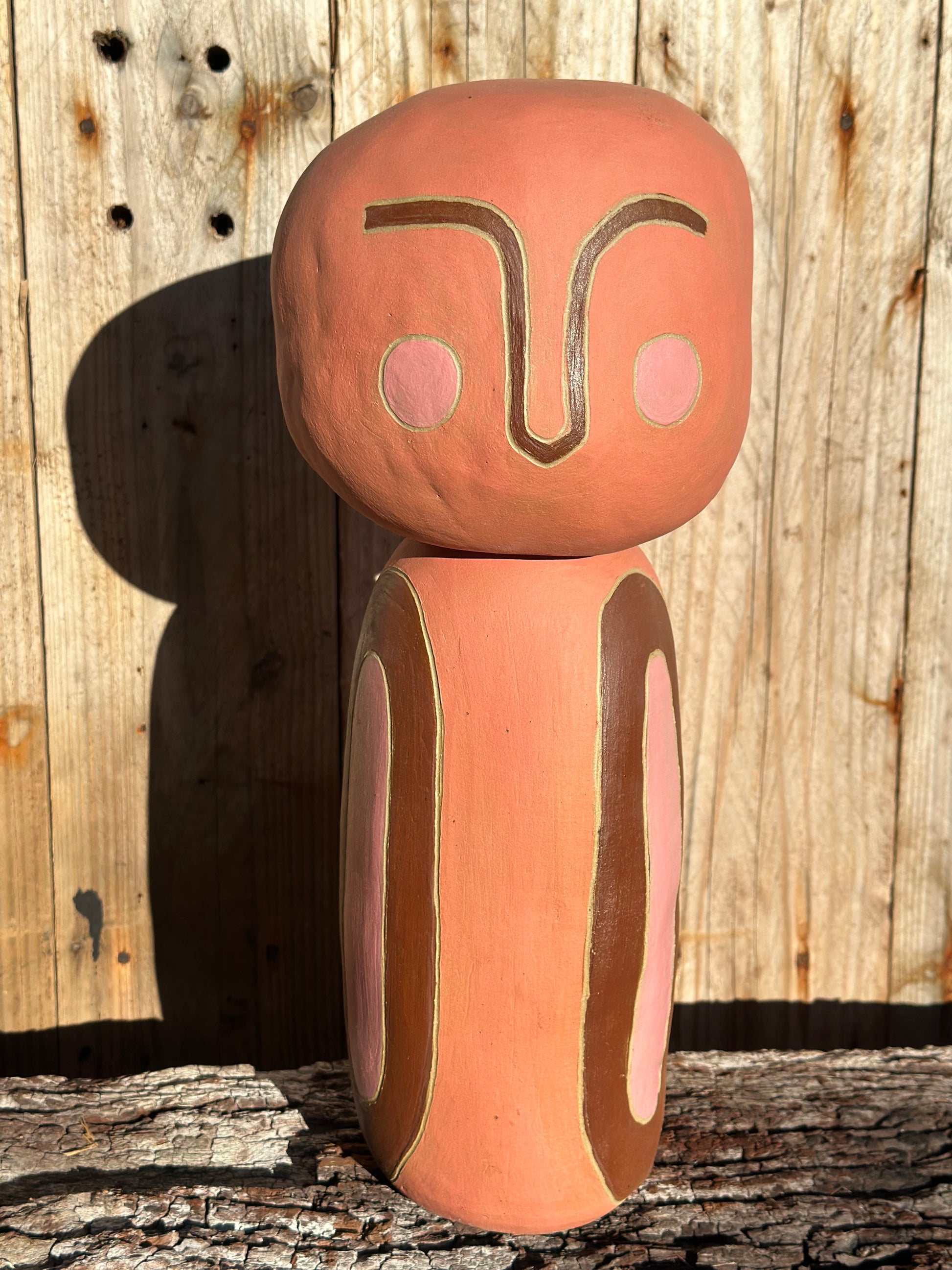 Hand-built ceramic sculpture with cylindrical form and autumn-toned underglazes, titled Little Being 2 by Heidi Dickinson