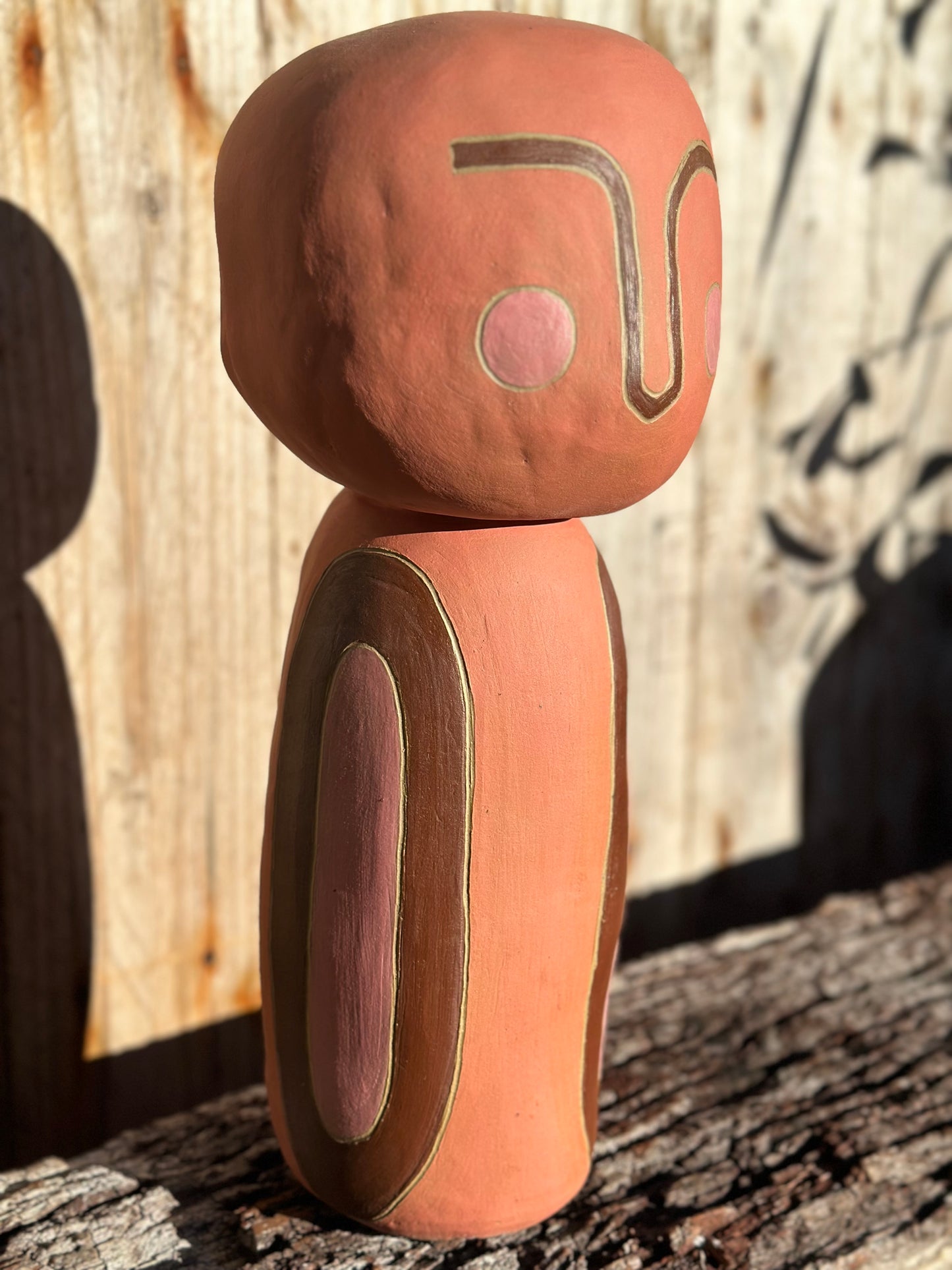 Side view Detail of sgraffito lines etched into earthy ceramic surface, suggesting a quiet figure in Little Being 2