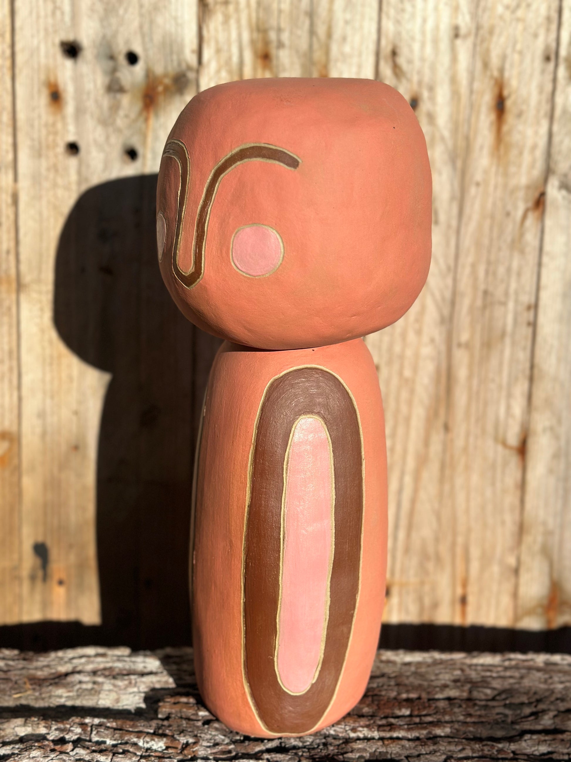 Side view Ceramic sculpture Little Being 2 styled in an interior space, radiating calm presence and earthy elegance, side view